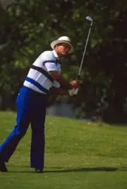 Golfer Juan Chi Chi Rodriguez swings and watches the flight of Golf 1988 Photo 1