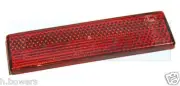 GENUINE LAND ROVER DEFENDER 2004-> O/E RED REAR STICK ON SELF ADHESIVE REFLECTOR