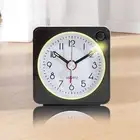 Mini alarm clock for travel with quiet ticking and built in snooze function
