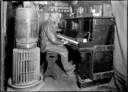 Herbert Ponting - Cecil Meares at the Piano Antarctica (1912) -17"x22" Art Print