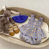 在飛比找ETMall東森購物網優惠-夏季女寶寶滿月格子套裝洋氣無袖娃娃衫+花苞短褲兩件套周歲衣服