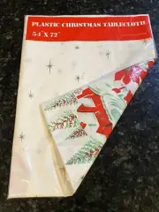 Vtg Christmas Santa Sleigh Reindeer Starburst Tablecloth 54”x 72" Plastic New