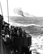 Men Watch USS Belleau Wood CVL-24 and USS Franklin CV-13 Afire Photo