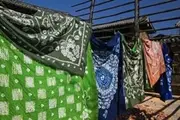 Batik Fabric Souvenirs at a Market stall, Baisha, Lijiang, Yunnan Province, China Poster Print by Panoramic Images (36 x 24)
