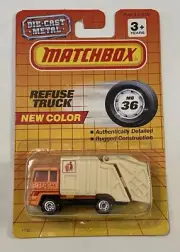 Matchbox Superfast #36 Refuse Truck the color is bright orange with white body.