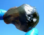 Libyan Desert Glass Meteorite Tektite impact specimen( 305 ct)Dimples Super dark