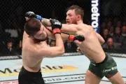 Conor McGregor punches Khabib Nurmagomedov at UFC 229, Las Vegas 2018 12x8 Photo