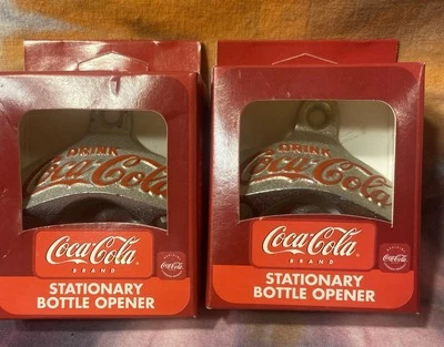 2 COCA COLA STATIONARY BOTTLE OPENERS. ALL METAL CONSTRUCTION. NEW IN BOX. @@@@@