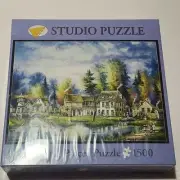 Bits And Pieces 1500 Piece Studio Puzzle Kirk Randle "Village Lake"