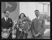 Singer Gladys Moncrieff holding a bouquet of flowers flanked by tw- Old Photo