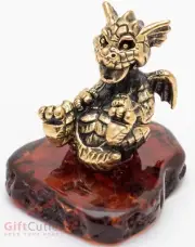 Brass amber figurine of laughing dragon on the back IronWork