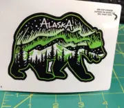 Alaska Sticker - Grizzly Bear w/ aurora above mountains die cut sticker