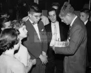 JOHN F. KENNEDY SIGNS HIS BOOK "PROFILES IN COURAGE" - 8X10 PHOTO (ZZ-053)