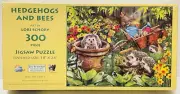 Hedgehogs and Bees 300-piece puzzle from SunsOut Art by Lori Schory Sealed.