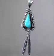 Hand Crafted Native American Turquoise Pendant with Feather Accent