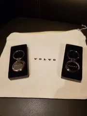 Pair of VOLVO Key Fobs - OEM - Chrome & Black with zippered canvas manual case