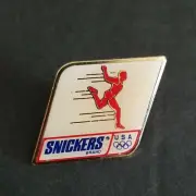 NEW VINTAGE 1991 USA OLYMPIC TRACK SNICKERS CANDY BAR ADVERTISING PIN PINBACK