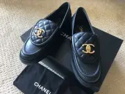NEW CHANEL Size 37EU Black Quilted Flap Turnlock Gold CC Logo Loafer
