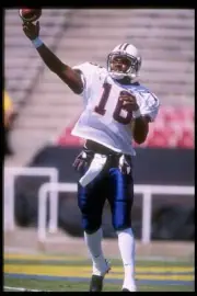 Quarterback Ortege Jenkins University of Arizona throws a pass at - Old Photo