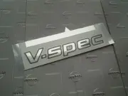 Nissan Genuine R34 Skyline Gt-R Rear V-Spec Emblem Bnr34 Nismo