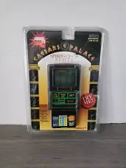 ~NEW~ Caesars Palace SPIRIT OF 76 Talking LCD Handheld Slot Machine Game 1995