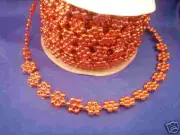 Pearls on a string flower star shapes 10 yards red