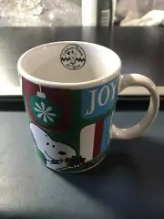 HOLIDAY JOY SNOOPY WITH PRESENTS 11 oz Mug Cup Celebrates Peanuts 60 Years