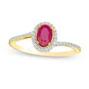 Oval Ruby and 0.13 CT. T.W. Natural Diamond Frame Bypass Ring in Solid 10K Yellow Gold