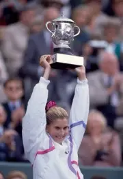 Monica Seles of Yugoslavia lifts the trophy after defeating Steffi- Old Photo 1