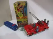 FIRE TRUCK- BATTERY OP- HAS FLASHING LIGHT-OPERATING LADDER-NEW N BOX WORKS-