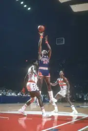 Garfield Heard Phoenix Suns shoots over Bob Dandridge Washington B- Old Photo