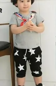 BNWT Kids Unisex Black Star Print Harem Capri Pants Size: 130 (4-5yrs)