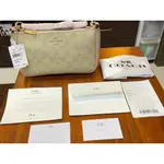 [恩納小天使] 全新正品美國US COACH櫻花粉斜跨肩背兩用彎月包