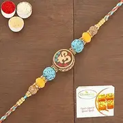 Ghasitaram Gifts Rakhi for Brother Rakhis Online - RM572 - Blue Om Bracelet Rakhi with 400 GMS of Besan Barfi