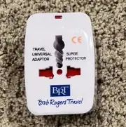 Universal AC Power Travel Adapter Europe/UK/US/Japan Surge Protector Light CE