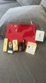 YSL Red Cosmetic Bag With YSL Candy Glaze Lip Stick, Pore Refiner And More