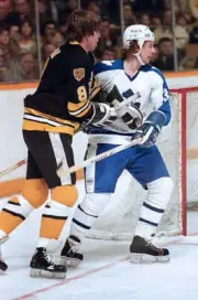 Ron Zanussi of theToronto Maple Leafs holds back Peter Mc- Ice Hockey Old Photo