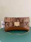 New Michael Kors brown leather handbag(clutch) org $298