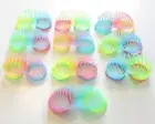 10 NEW MAGIC GLOW IN THE DARK COIL SPRINGS MULTI COLORED 3" PLASTIC COIL SPRING