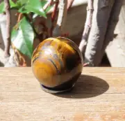 A Grade Polished Tiger Eye Crystal Sphere With Hematite Ring 66 Grams Balance