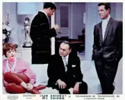 Shirley MacLaine sits with Edward G Robinson Robert Cummings in My- Old Photo
