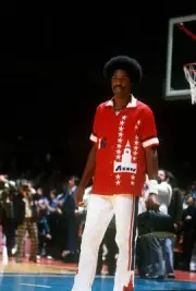 Julius Erving Philadelphia 76ers walks onto the court holding a do- Old Photo