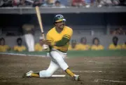 Outfielder Reggie Jackson Oakland Athletics swings at a pitch at - 1974 Photo