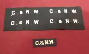 VINTAGE NEVER USED C.N. & W. WOOL BACKED SILVER UNIFORM INSIGNIA LETTERING