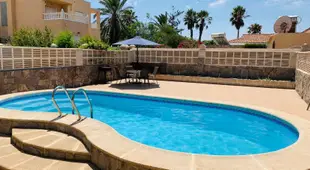 Villa with private pool with rooftop pergola. 1min from the beach