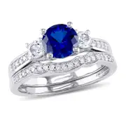 6.0mm Lab-Created Blue and White Sapphire with 1/8 CT. T.W. Diamond Three Stone Bridal Engagement Ring Set in 14K White Gold