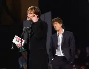 Jim Carrey wins the Leading Man award presented by Mick Jagger Old Photo 1