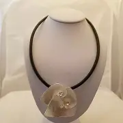 Black leather cord necklace with a silver 3-petal flower design and clear crysta
