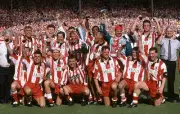 Stoke City manager Lou Macari holding the trophy as the Stoke City- Old Photo