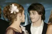 Daniel Radcliffe and Emma Watson attend the UK Premiere of Harry - 2004 Photo 5
